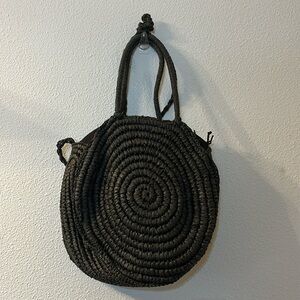 Straw Studios woven circle bag with shoulder straps and crossbody straps